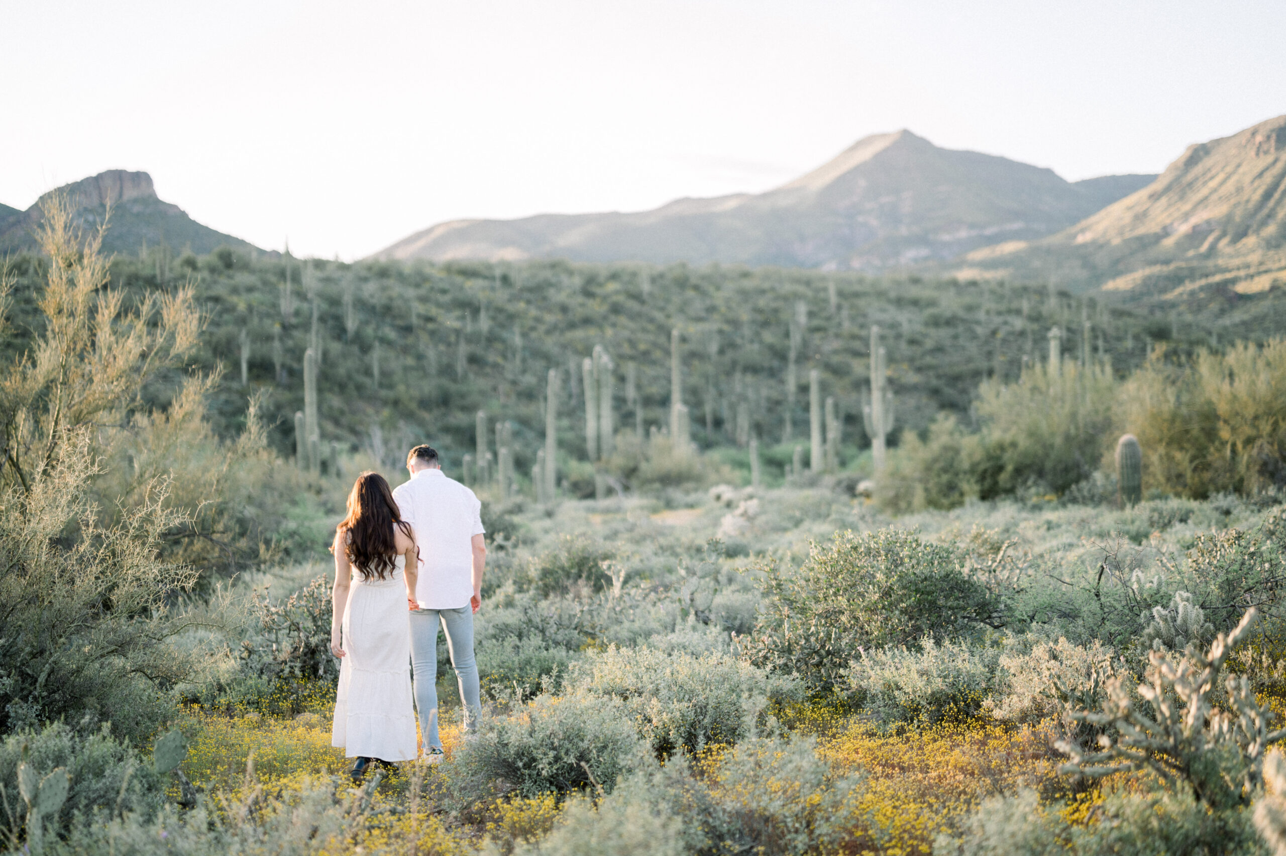 Kennedy and Jareds glowy desert engagement session was one for the books. After a heavy rainfall, we had the most beautiful scenery!